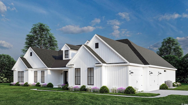 974 Crooked Oak Dr, Pawleys Island, SC 29585 - modern farmhouse style home with board and batten siding, a front lawn, central AC, a garage, and metal roof