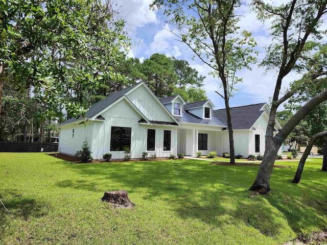 974 Crooked Oak Dr, Pawleys Island, SC 29585 - modern farmhouse style home with board and batten siding and a front yard