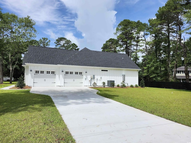 974 Crooked Oak Dr, Pawleys Island, SC 29585 - modern inspired farmhouse with board and batten siding, driveway, an attached garage, and roof with shingles
