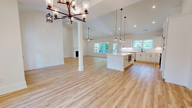 974 Crooked Oak Dr, Pawleys Island, SC 29585 - kitchen featuring open floor plan, a kitchen island, a chandelier, hanging light fixtures, and recessed lighting