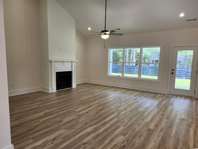 974 Crooked Oak Dr, Pawleys Island, SC 29585 - unfurnished living room featuring wood finished floors, ceiling fan, a fireplace, recessed lighting, and vaulted ceiling