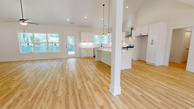 974 Crooked Oak Dr, Pawleys Island, SC 29585 - unfurnished living room featuring high vaulted ceiling, light wood-style floors, a ceiling fan, and recessed lighting