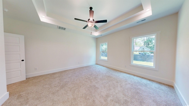 974 Crooked Oak Dr, Pawleys Island, SC 29585 - empty room featuring a tray ceiling, ceiling fan, and carpet floors