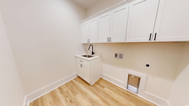974 Crooked Oak Dr, Pawleys Island, SC 29585 - laundry room featuring washer hookup, electric dryer hookup, cabinet space, and light wood-type flooring
