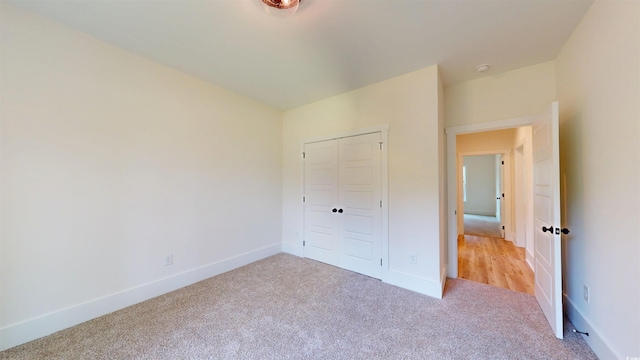 974 Crooked Oak Dr, Pawleys Island, SC 29585 - unfurnished bedroom with light carpet and a closet