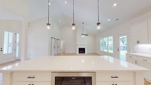 974 Crooked Oak Dr, Pawleys Island, SC 29585 - kitchen with a ceiling fan, a fireplace, beverage cooler, light countertops, and recessed lighting