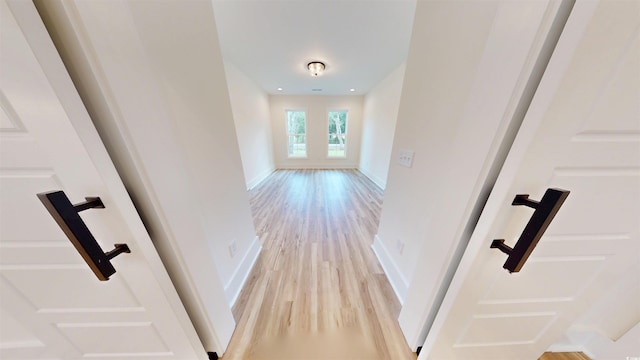 974 Crooked Oak Dr, Pawleys Island, SC 29585 - corridor featuring light wood-type flooring and baseboards