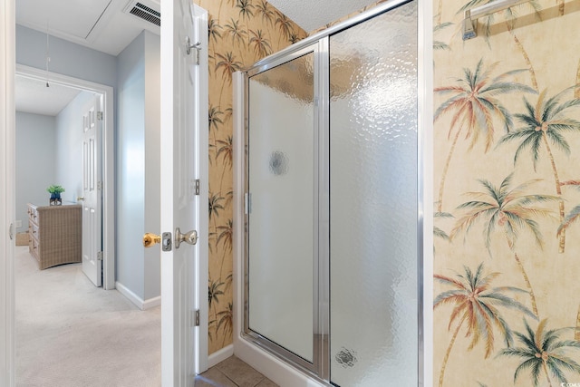 full bath featuring visible vents, baseboards, and a stall shower