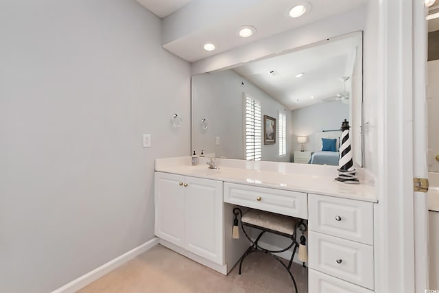 bathroom with recessed lighting, vanity, and ceiling fan