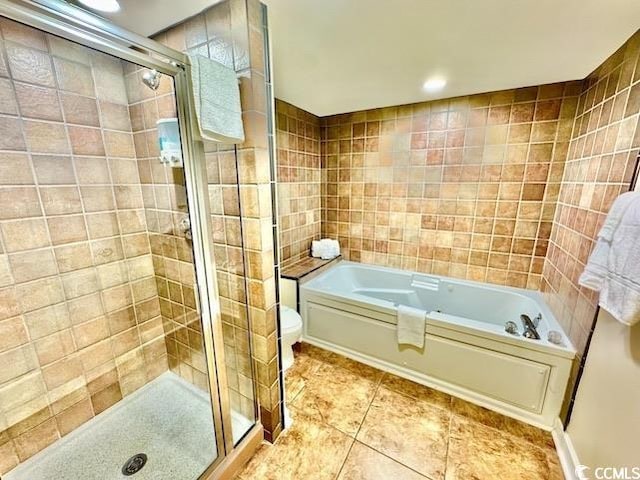 full bathroom with a bath, tile walls, tile patterned flooring, and a stall shower