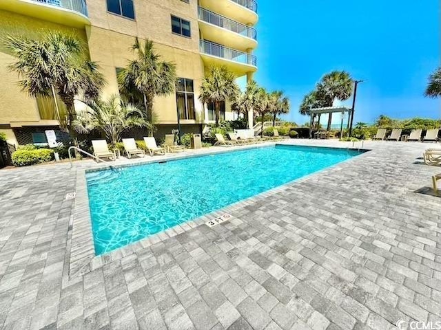 community pool with a patio
