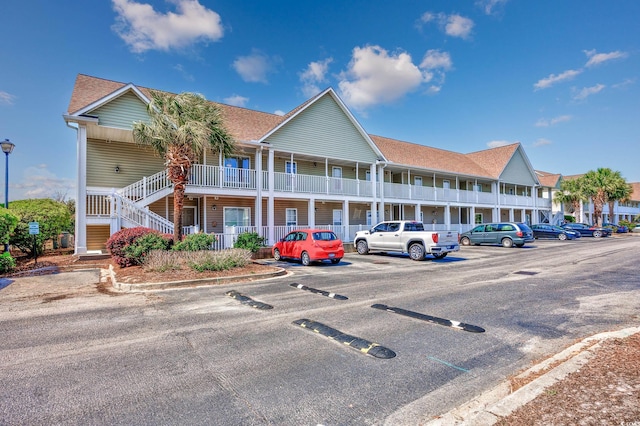 117 Butkus Dr Unit 5, Myrtle Beach, SC 29588 - view of property with uncovered parking and stairs