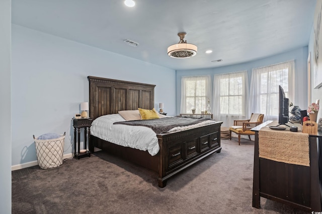 carpeted bedroom featuring recessed lighting, visible vents, and baseboards