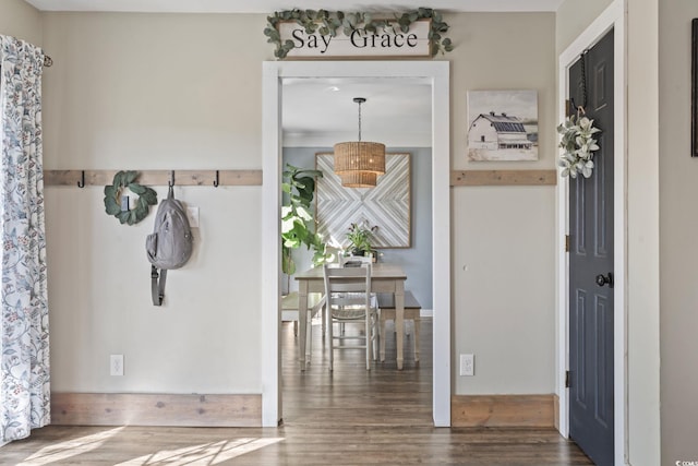 mudroom with wood finished floors