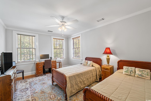 bedroom featuring ornamental molding, visible vents, and light wood-type flooring