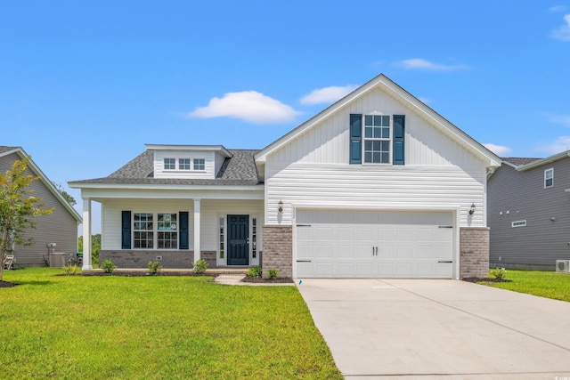 364 Hayloft Cir, Conway, SC 29526 - view of front facade with brick siding, a front yard, concrete driveway, a porch, and a garage