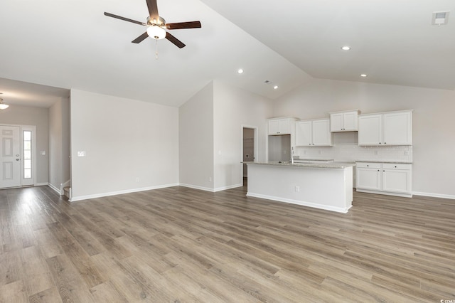 364 Hayloft Cir, Conway, SC 29526 - unfurnished living room featuring a ceiling fan, high vaulted ceiling, recessed lighting, and light wood-style flooring