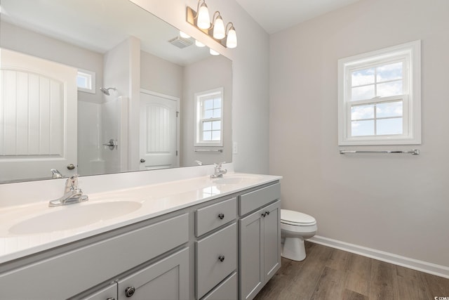 364 Hayloft Cir, Conway, SC 29526 - bathroom featuring double vanity, plenty of natural light, wood finished floors, and a shower