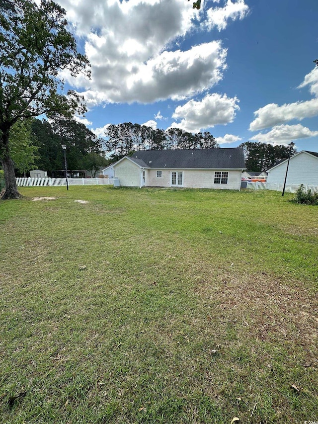 view of yard featuring fence