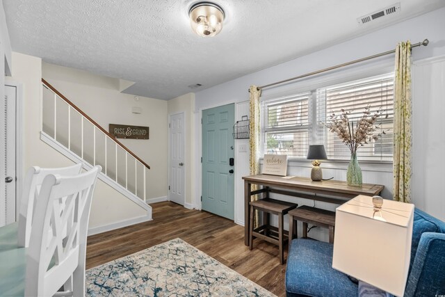 5508 Porcher Dr Unit 3, Myrtle Beach, SC 29577 - foyer with wood finished floors, stairs, a textured ceiling, and baseboards