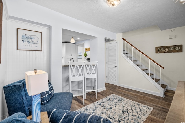 5508 Porcher Dr Unit 3, Myrtle Beach, SC 29577 - living area featuring stairway, wood finished floors, a textured ceiling, and baseboards