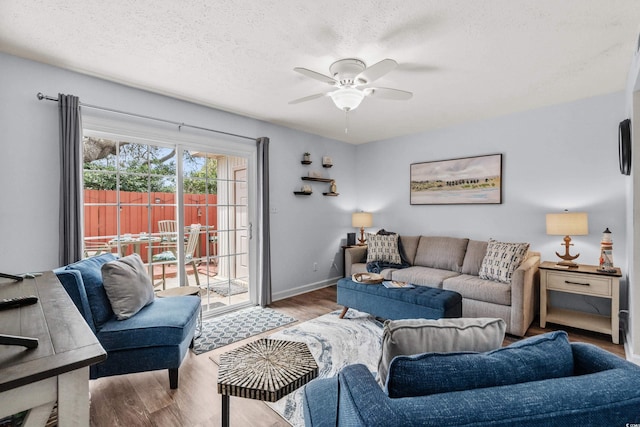 5508 Porcher Dr Unit 3, Myrtle Beach, SC 29577 - living room with wood finished floors, a ceiling fan, a textured ceiling, and baseboards