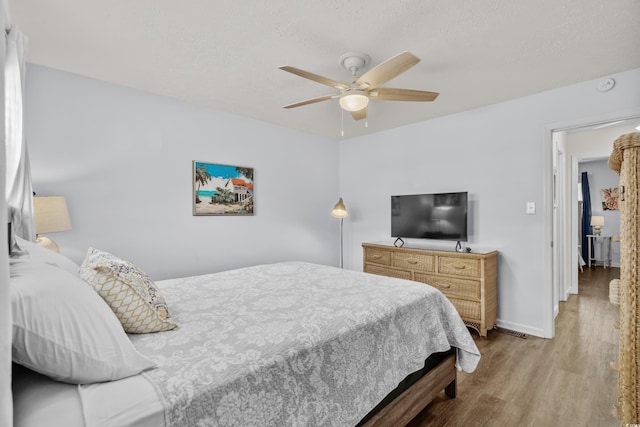 5508 Porcher Dr Unit 3, Myrtle Beach, SC 29577 - bedroom with wood finished floors, baseboards, and ceiling fan