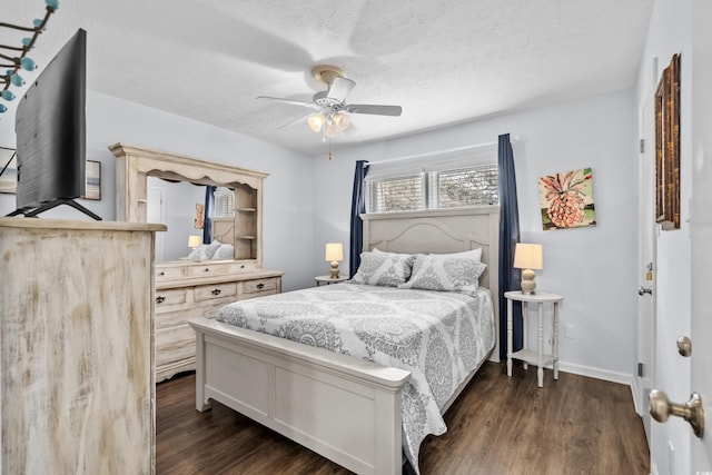 5508 Porcher Dr Unit 3, Myrtle Beach, SC 29577 - bedroom featuring dark wood-style flooring, a textured ceiling, ceiling fan, and baseboards