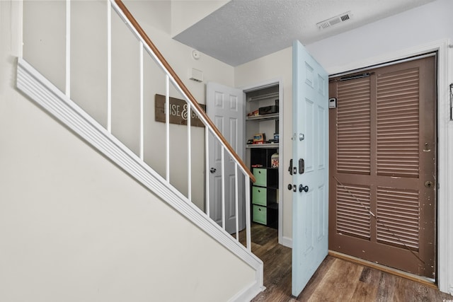 5508 Porcher Dr Unit 3, Myrtle Beach, SC 29577 - foyer entrance featuring wood finished floors, stairs, and a textured ceiling