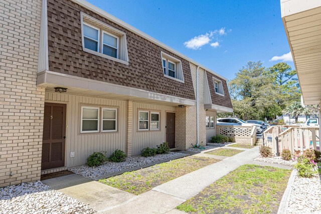 5508 Porcher Dr Unit 3, Myrtle Beach, SC 29577 - multi unit property featuring mansard roof, a shingled roof, and brick siding