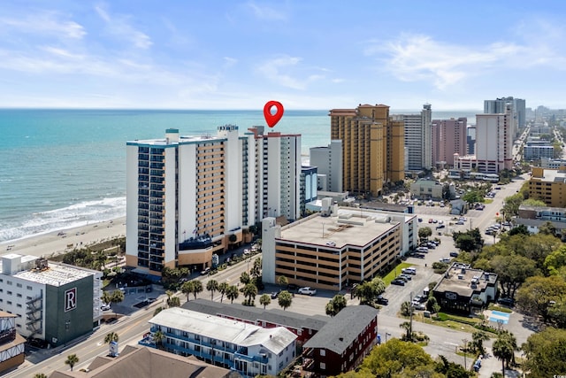 drone / aerial view with a view of city, a beach view, and a water view
