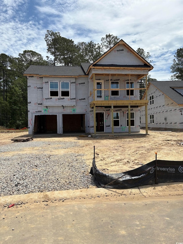 8743 Baton Rouge Ave NW, Calabash, NC 28467 - unfinished property featuring a garage and gravel driveway