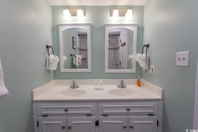 2001 S Ocean Blvd Unit 207, Myrtle Beach, SC 29577 - bathroom featuring double vanity, a tile shower, and a sink