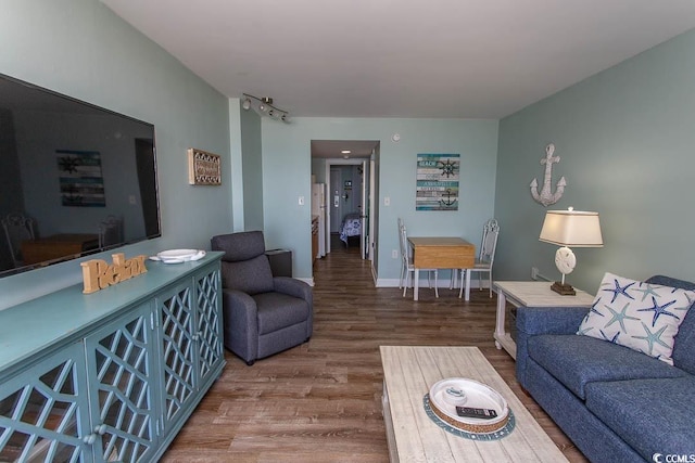 2001 S Ocean Blvd Unit 207, Myrtle Beach, SC 29577 - living area featuring baseboards and wood finished floors