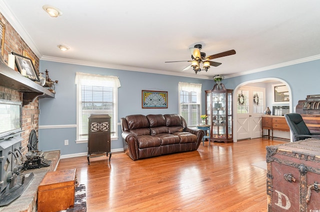 1315 Sioux Swamp Dr, Conway, SC 29527 - living room featuring a ceiling fan, arched walkways, plenty of natural light, and light wood-style floors
