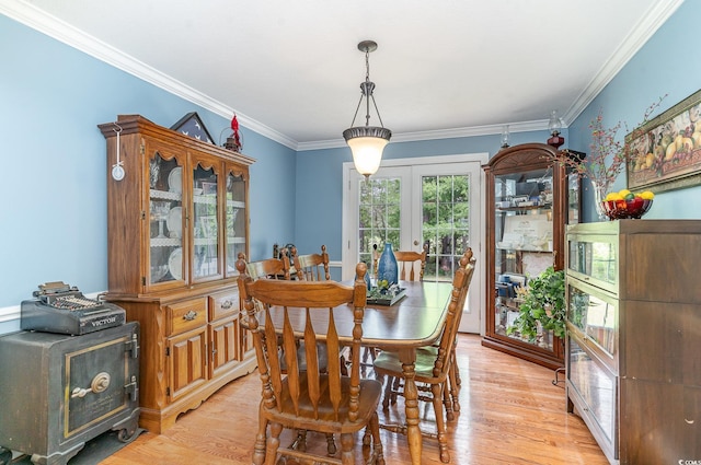 1315 Sioux Swamp Dr, Conway, SC 29527 - dining room with french doors, crown molding, and light wood-style flooring