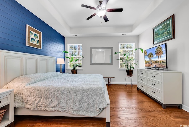 522 Heartland Ct, Murrells Inlet, SC 29576 - bedroom featuring a raised ceiling, dark wood-type flooring, baseboards, and a ceiling fan