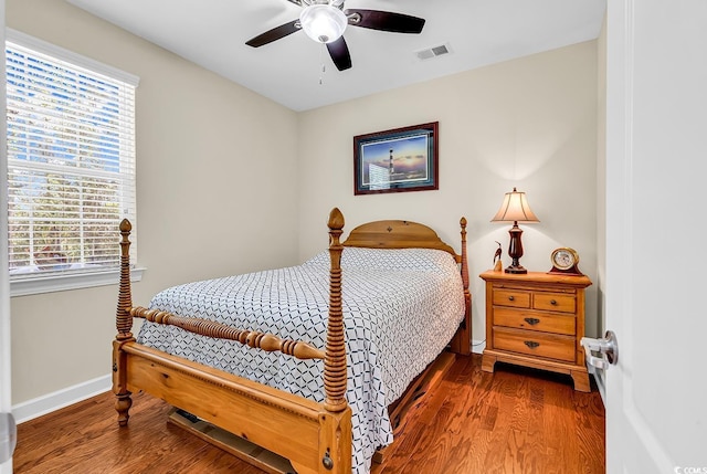 522 Heartland Ct, Murrells Inlet, SC 29576 - bedroom with wood finished floors, baseboards, a ceiling fan, and visible vents