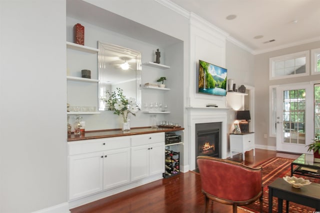 1406 Seabrook Plantation Way N, Myrtle Beach, SC 29582 - living room with crown molding, dark wood-style flooring, a glass covered fireplace, ceiling fan, and baseboards
