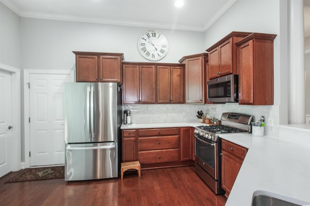 1406 Seabrook Plantation Way N, Myrtle Beach, SC 29582 - kitchen featuring appliances with stainless steel finishes, backsplash, dark wood-type flooring, light countertops, and crown molding