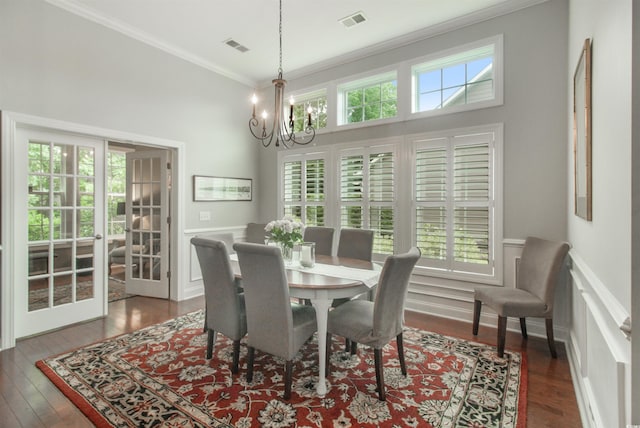 1406 Seabrook Plantation Way N, Myrtle Beach, SC 29582 - dining space featuring ornamental molding, a chandelier, french doors, hardwood / wood-style flooring, and wainscoting
