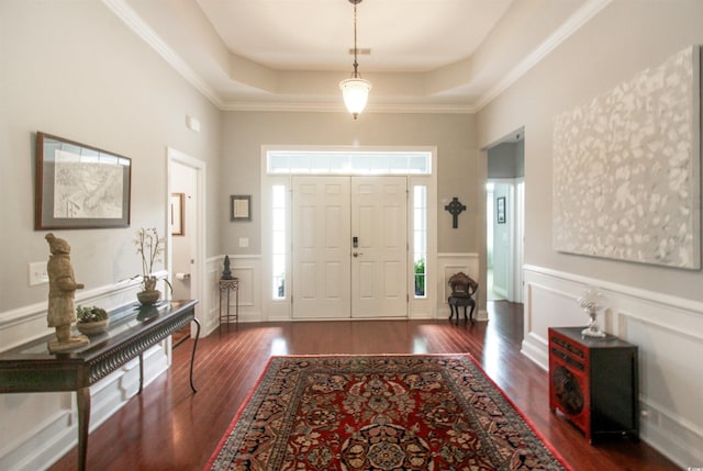 1406 Seabrook Plantation Way N, Myrtle Beach, SC 29582 - foyer entrance featuring dark wood finished floors, a tray ceiling, a decorative wall, a towering ceiling, and a wainscoted wall