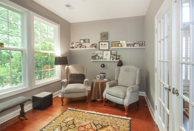 1406 Seabrook Plantation Way N, Myrtle Beach, SC 29582 - living area featuring healthy amount of natural light, wood finished floors, and baseboards