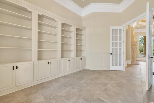 1563 Cadiz Dr, Myrtle Beach, SC 29579 - spare room featuring ornamental molding, french doors, a high ceiling, and a wainscoted wall