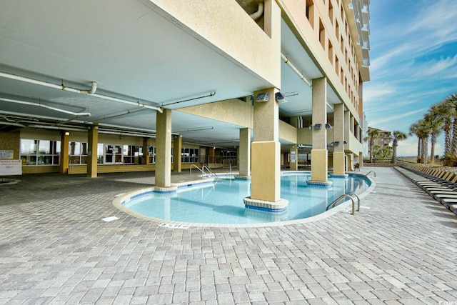 community pool featuring a patio area