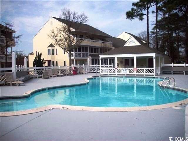 1100 Possum Trot Rd Unit G-216, North Myrtle Beach, SC 29582 - community pool featuring a patio area