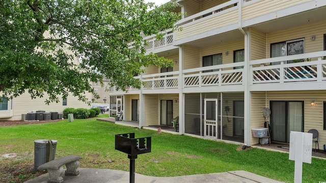 1100 Possum Trot Rd Unit G-216, North Myrtle Beach, SC 29582 - rear view of property with a yard and central AC