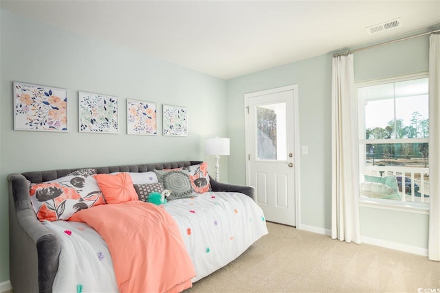 9738 Indigo Creek Blvd, Murrells Inlet, SC 29576 - bedroom featuring light colored carpet, multiple windows, and baseboards