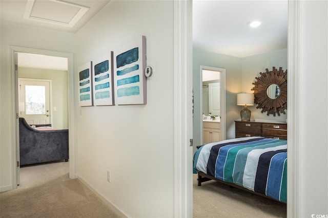 9738 Indigo Creek Blvd, Murrells Inlet, SC 29576 - corridor featuring carpet flooring, attic access, baseboards, and a sink
