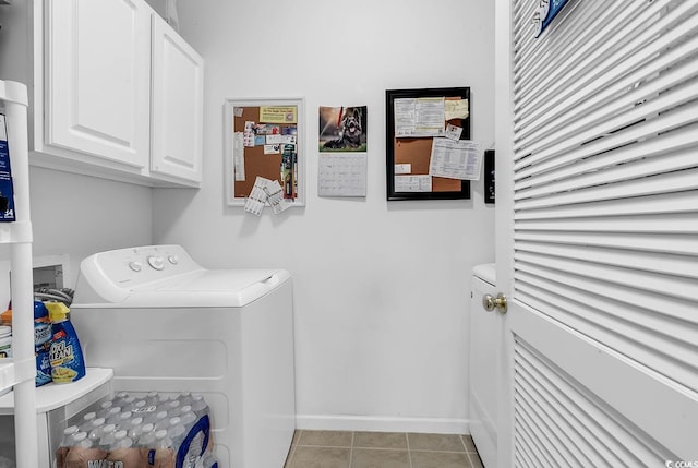 laundry room featuring independent washer and dryer, cabinet space, baseboards, and light tile patterned flooring